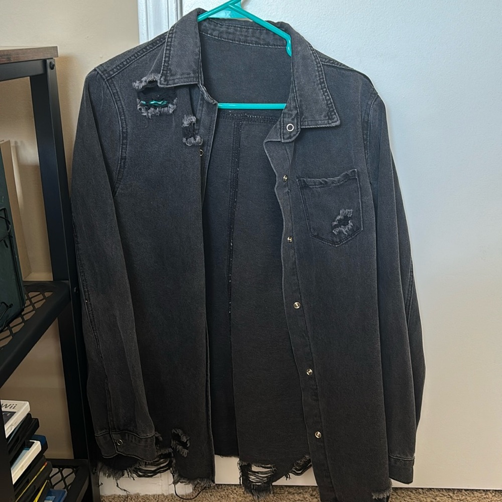 Size medium black jean jacket with rips